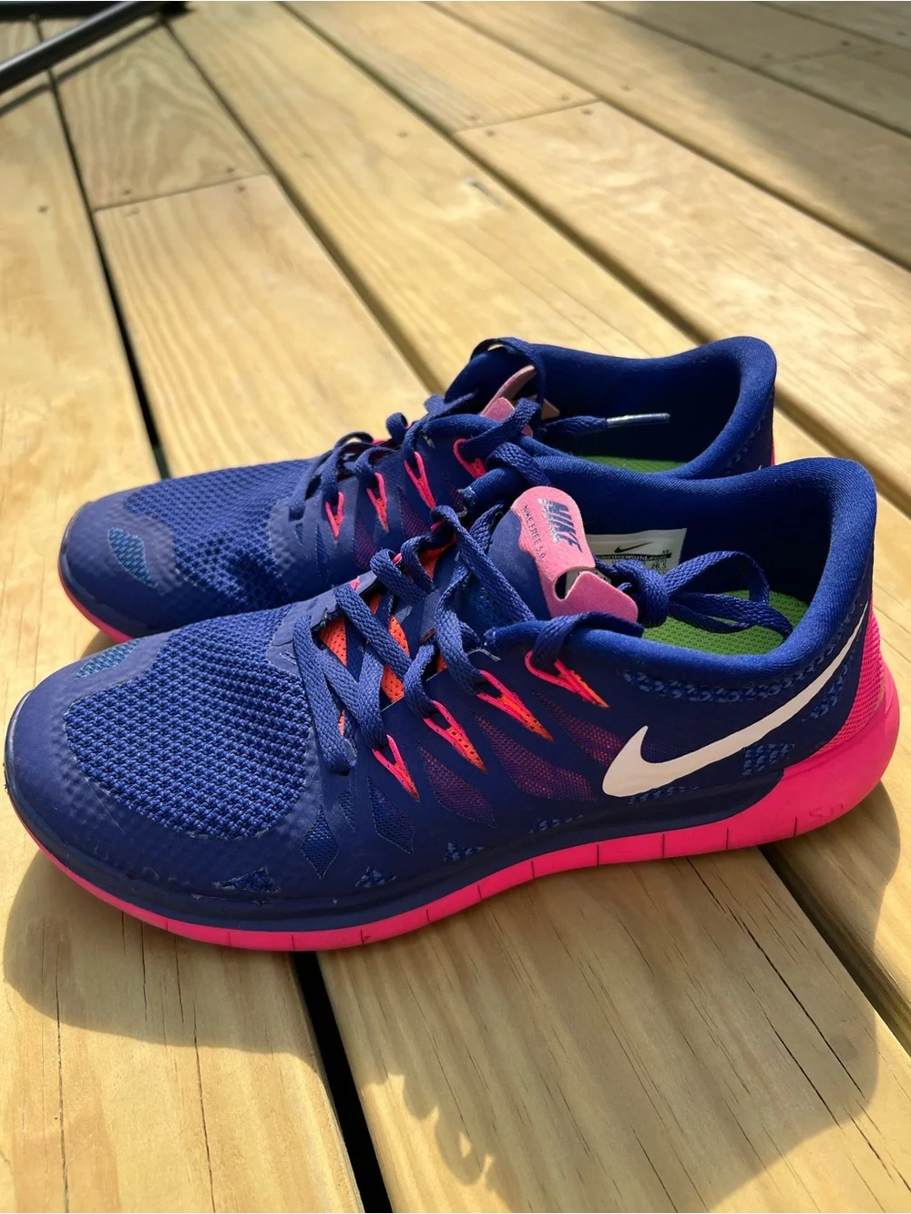 Nike Women’s Navy Blue and Hot Pink Athletic Running Shoes. Nike Free 5.0